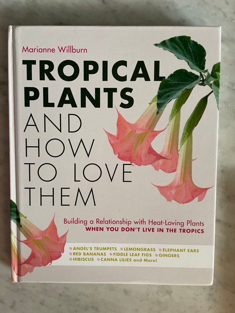Front cover of a gardening book with apricot colored angel trumpet flowers dangling down. Tropical Plants and How to Love them by Marianne Wilburn.