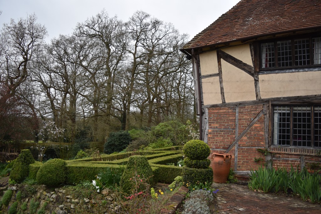 Longbarn garden view of side of fourteenth century house and garden