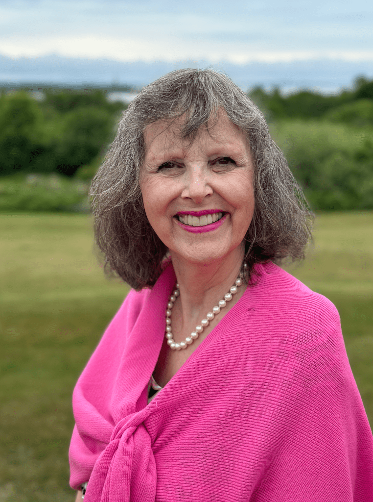 A picture of a lady in pink - Gardener Jenny Rose Carey