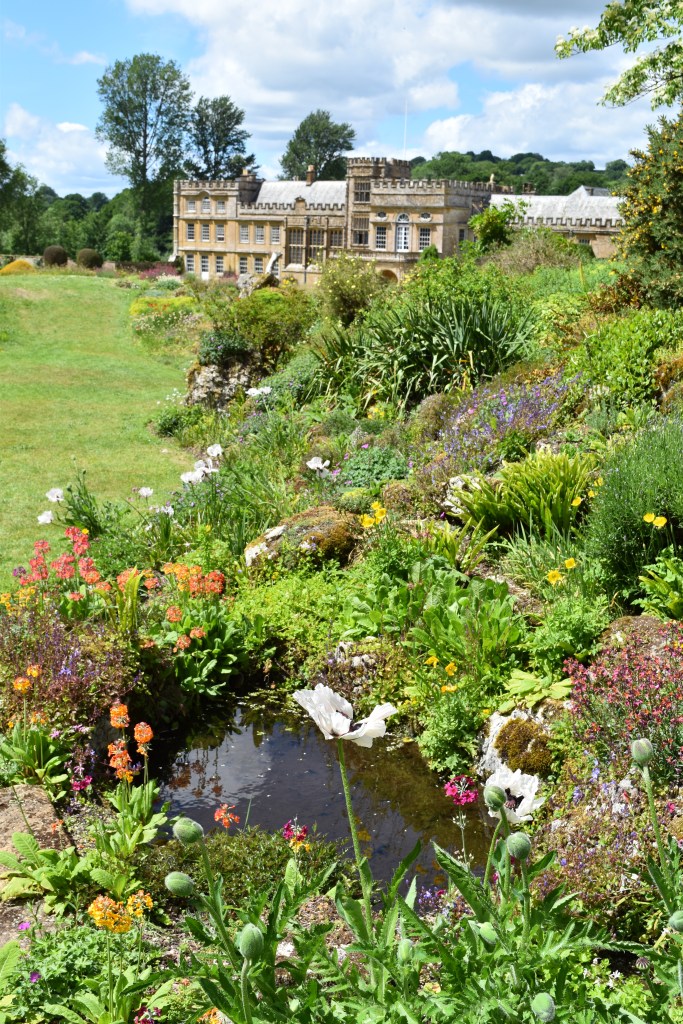 The rock garden at Forde Abbey with the house in the distance