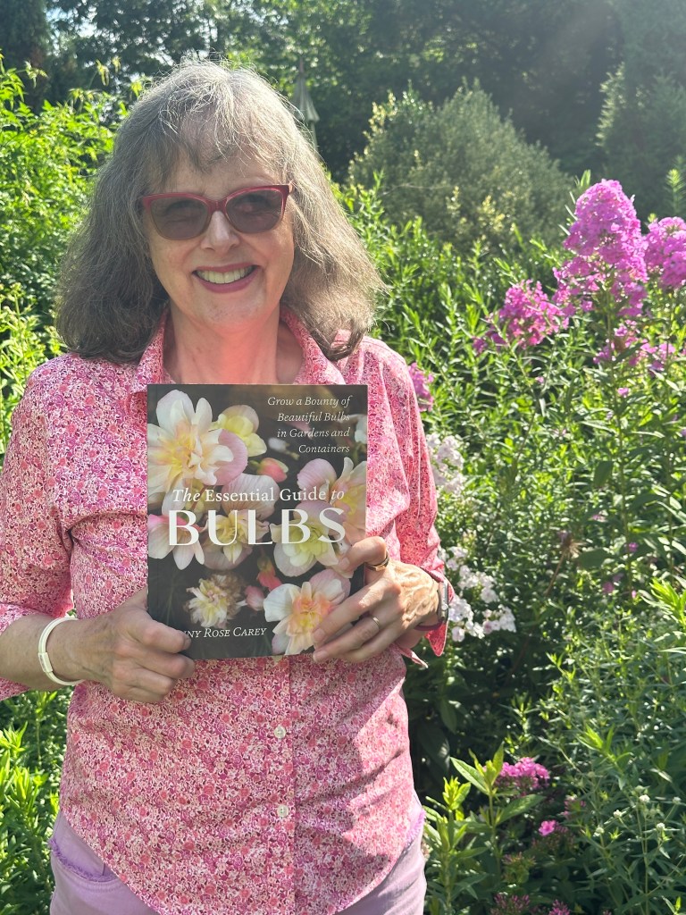 Jenny Rose Carey holding her new Bulb Book - 'The Essential Guide to Bulbs'