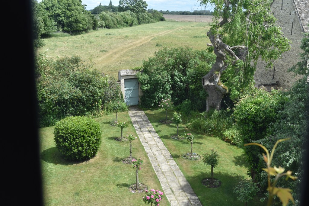 The view from the upstairs window at Kelmscott Manor shows the reverse view of the first photo looking out over the countryside.