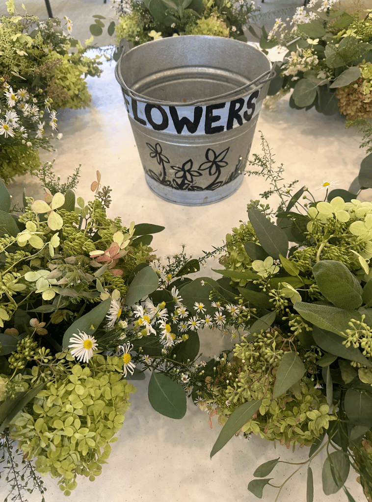 The base of the flower arrangements was chartreuse and sage green