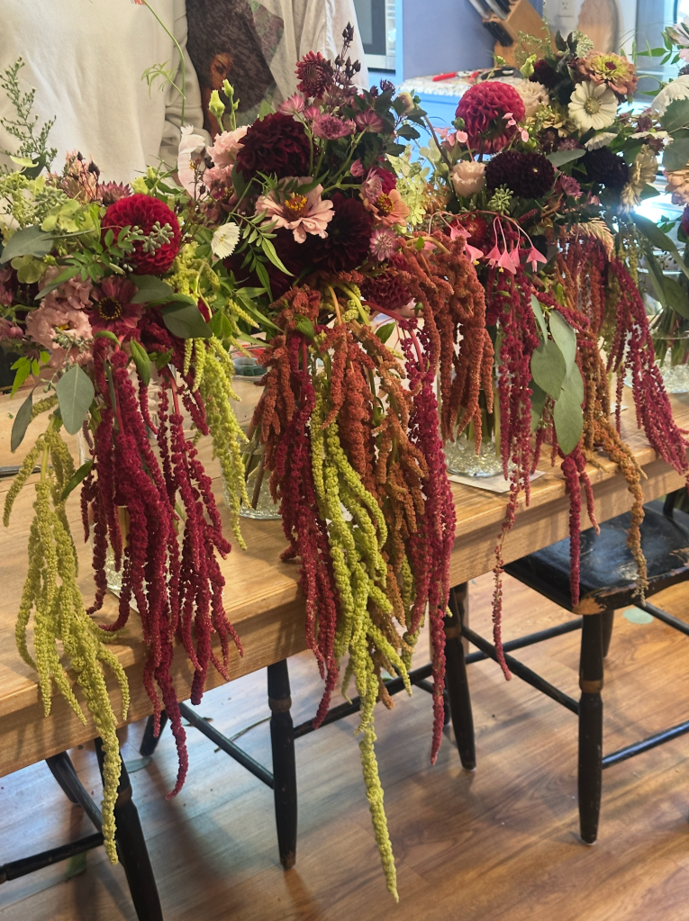 Bride and bridesmaids wedding bouquets including draping amaranthus
