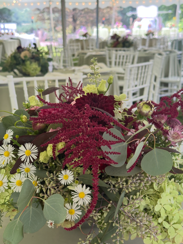 Wedding Flowers under a big tent